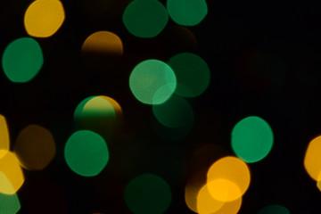 Bokeh. Christmas lights. Holiday background. Garland. Glitter. Defocused sparkles. Festive. New Year backdrop. Blinks. Carnival. Bokeh retro style photo. Multicolor. Colorful.