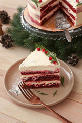 Piece of tasty Christmas cake on wooden table