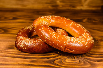 Bagels with sesame seeds on wooden table