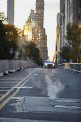 Fototapeta na wymiar Smoke in the street of New York with car on background