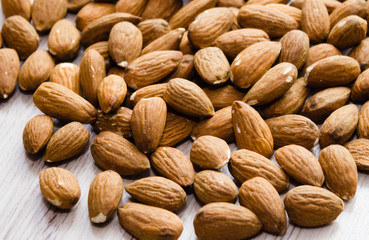 Almond. Almond on a wooden background macro. Almond background. Almond Nuts.