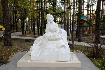 monument of a woman from white solid granite