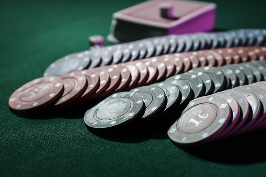 Chips for poker game on table in casino