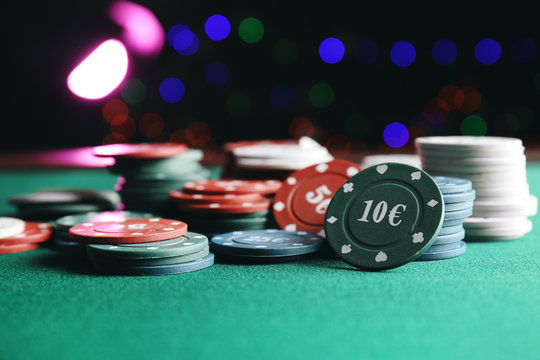 Chips for poker game on table in casino