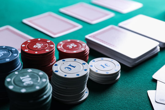 Chips and cards on table in casino