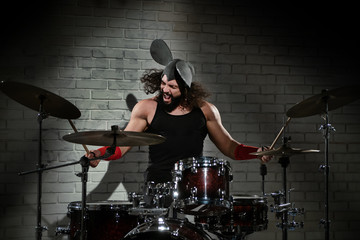 Drummer in a mouse costume