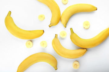 Ripe sweet bananas on white background