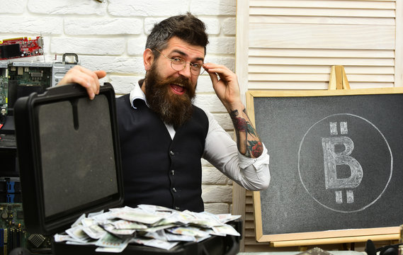 Smart and rich. Business man in server room. Bearded man with cash money. Bearded hipster with bitcoin symbol and dollars. From paper money to crypto currency. Bitcoin for business