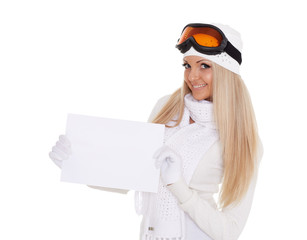 Young  woman in ski glasses with empty board for the text.