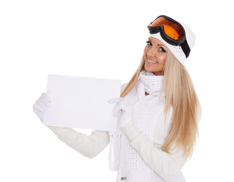 Young  woman in ski glasses with empty board for the text.