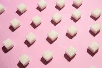 Many sugar cubes on color background