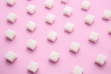 Many sugar cubes on color background