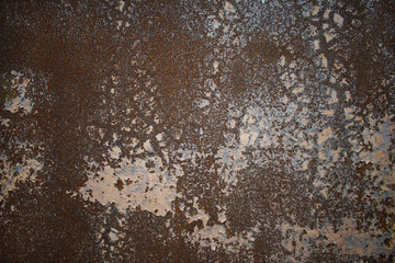 Old metal wall with peeled off paint.