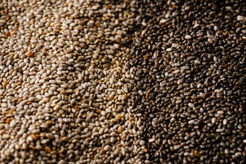 Black and white chia seeds texture. Superfood closeup, selective focus