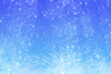 Fototapeta na wymiar Winter blue sky with falling snow.