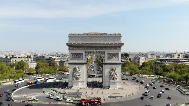 Traffic on Place Charles de Gaulle with Arc de Triomphe at sunny day. Aerial view