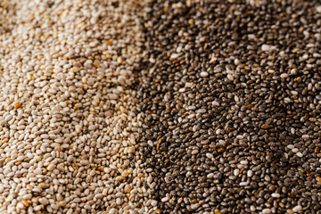 Black and white chia seeds texture. Superfood closeup, selective focus