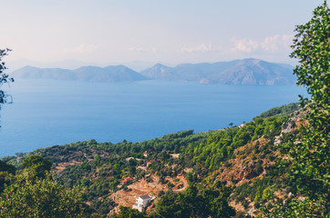Beautiful landscape with calm water and mountains on shore at sunny day, Kas, Antalya, turkey