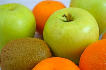 Delicious and fresh fruit on wooden background.