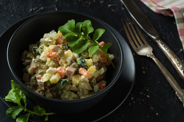 Bowl with traditional festive russian salad Olivie