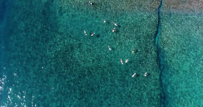 surfing in aerial view, teahupoo papeete french polynesia