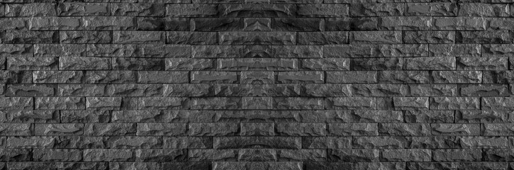 panorama of black brick wall of dark stone texture and background
