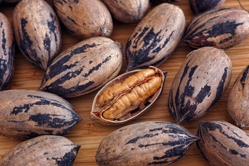 Organic pecan nuts on a wooden table