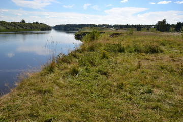 sloping bank of the river: calm in August