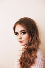 Naklejka premium Beautiful model girl with Fashion Luxury Makeup, long eyelashes, perfect skin facial make-up. Beauty Brunette model woman holiday make up close up. Eyelash extensions, false eyelashes. Beauty Woman.