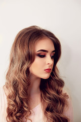 Fototapeta premium Beautiful model girl with Fashion Luxury Makeup, long eyelashes, perfect skin facial make-up. Beauty Brunette model woman holiday make up close up. Eyelash extensions, false eyelashes. Beauty Woman.