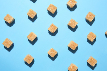 Many sugar cubes on color background