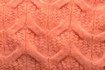 Coral knitted clothes, closeup
