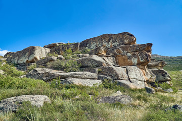 Beautiful panoramic summer steppe landscape of stone mountains 