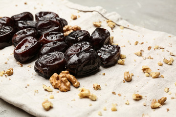 Sweet dried dates and nuts on napkin