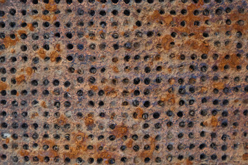 Rusty metal grid of the ballast system of a ship as a background or backdrop