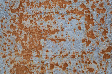Rusty hull surface of a ship as a backdrop or backdrop