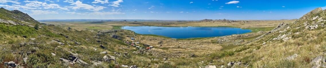 Fototapeta na wymiar Beautiful summer steppe landscape and Ayr (Monastyri) Lake, located in stone mountains 