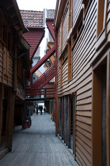 Fototapeta premium Narrow alley between old wooden houses
