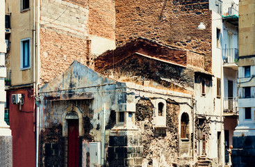 Travel to Italy -  historical street of Catania, Sicily, facade of old buildings.