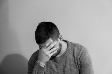 Portrait of a disappointed and discouraged young boy.