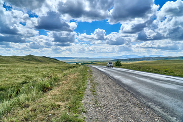 Beautiful landscape of steppe and stone mountains along the road from the city of Ust-Kamenogorsk to the Sibiny lakes (RU: Sibinskiye Ozora: Sadyrkol, Tortkara, Shalkar, Korzhynkol), East Kazakhstan