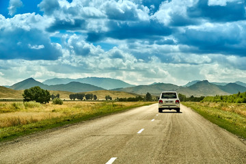 Beautiful landscape of steppe and stone mountains along the road from the city of Ust-Kamenogorsk to the Sibiny lakes (RU: Sibinskiye Ozora: Sadyrkol, Tortkara, Shalkar, Korzhynkol), East Kazakhstan