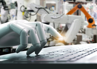 Robot concept or robot hand chatbot pressing computer keyboard enter industry