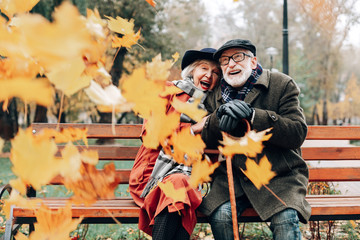 Positive delighted mature couple enjoying the moment