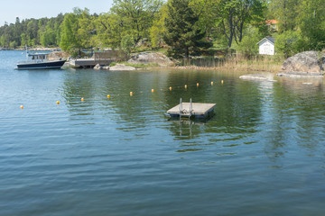 Naklejka premium One of Stockholm's finest bathing beaches with, sandy beach, rocky bath, jumping tower and more