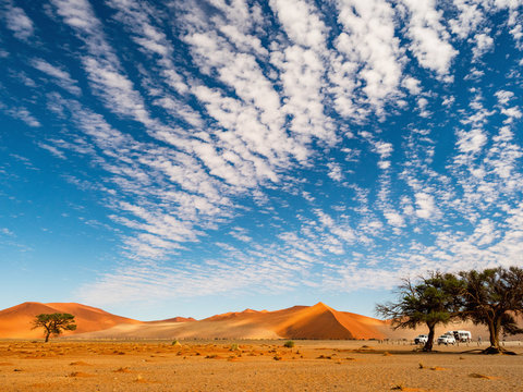 Big clouds over the salt pan Sossuvlei. Namib Naukluft National Park. Sand dunes in the pan of Sossusvlei. Namibia. Africa.