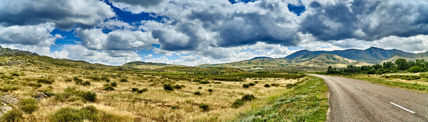 Beautiful landscape of steppe and stone mountains along the road from the city of Ust-Kamenogorsk to the Sibiny lakes (RU: Sibinskiye Ozora: Sadyrkol, Tortkara, Shalkar, Korzhynkol), East Kazakhstan