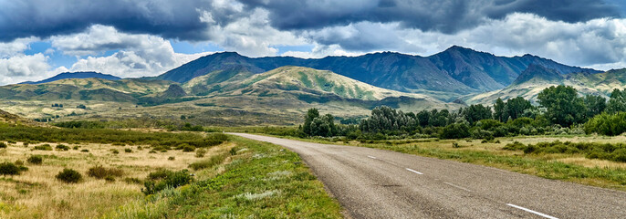 Beautiful landscape of steppe and stone mountains along the road from the city of Ust-Kamenogorsk to the Sibiny lakes (RU: Sibinskiye Ozora: Sadyrkol, Tortkara, Shalkar, Korzhynkol), East Kazakhstan