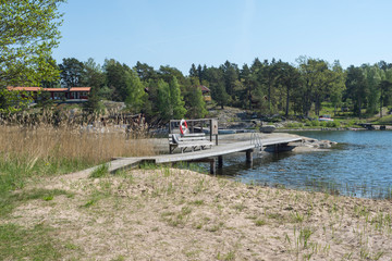 A wonderful beach with sandy beach, jetty and a cliff in the water