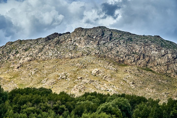 Beautiful landscape of steppe and stone mountains along the road from the city of Ust-Kamenogorsk to the Sibiny lakes (RU: Sibinskiye Ozora: Sadyrkol, Tortkara, Shalkar, Korzhynkol), East Kazakhstan